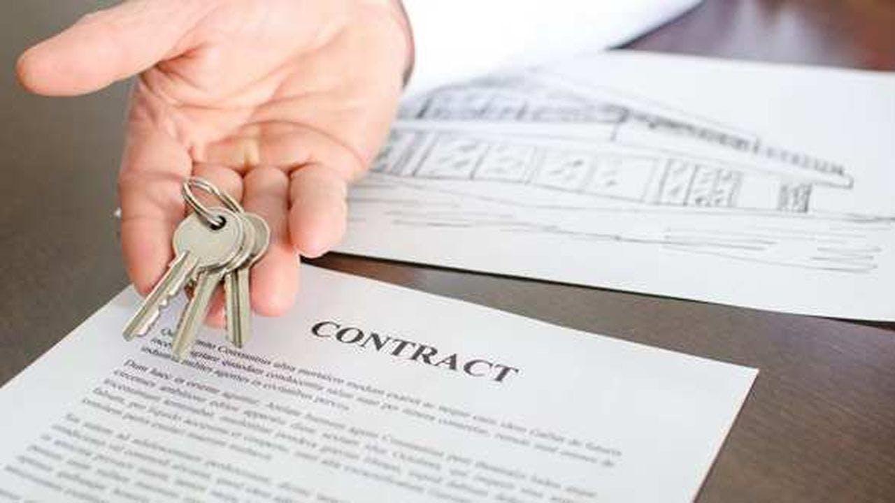 A contract and house keys 